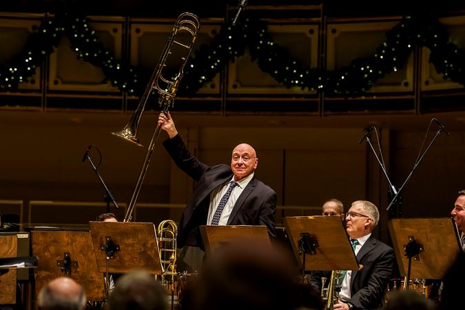 CSO trombone Charles Vernon raises his instrument in preparation for a bow