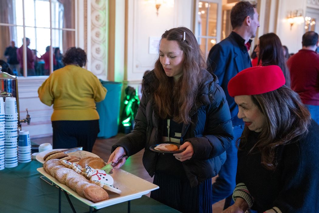 Patrons sample holiday cookies.
