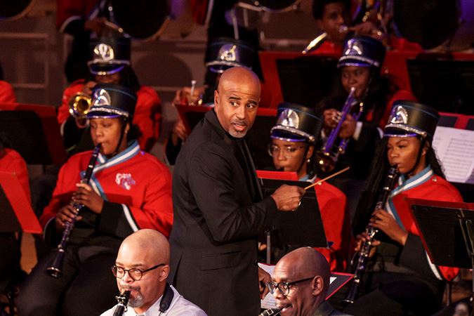 Closeup of Gerald Powell conducting the Kenwood Academy High School Marching Band