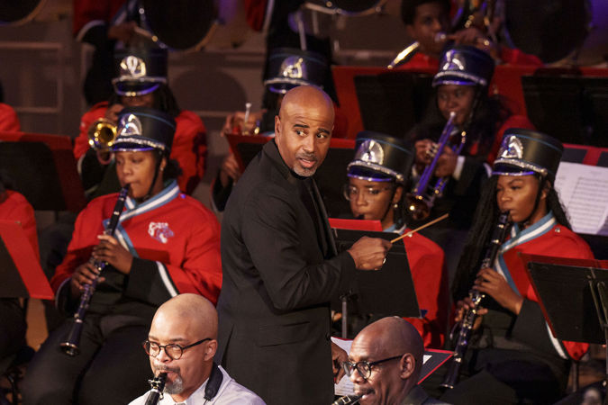 Closeup of Gerald Powell conducting the Kenwood Academy High School Marching Band