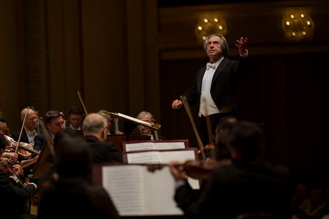 Closeup action shot of Riccardo Muti conducting the CSO