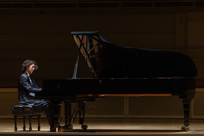 Sumino performs at a grand piano
