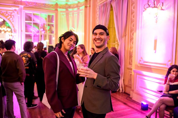 Two Underground attendees smiling at the camera in Grainger Ballroom