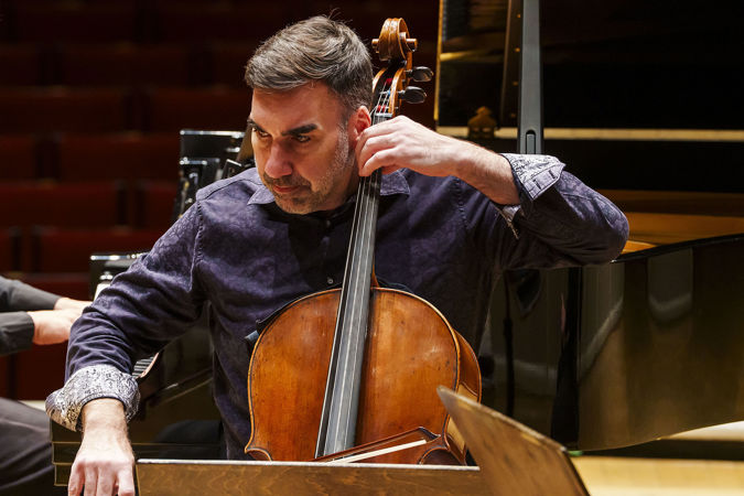 Closeup of CSO cello Kenneth Olsen performing on stage
