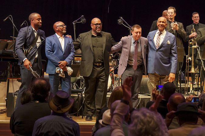 the guest artists take a bow, from left to right: guitarist Dan Wilson, drummer Lewis Nash, bassist Christian McBride, pianist Benny Green, and conductor John Clayton