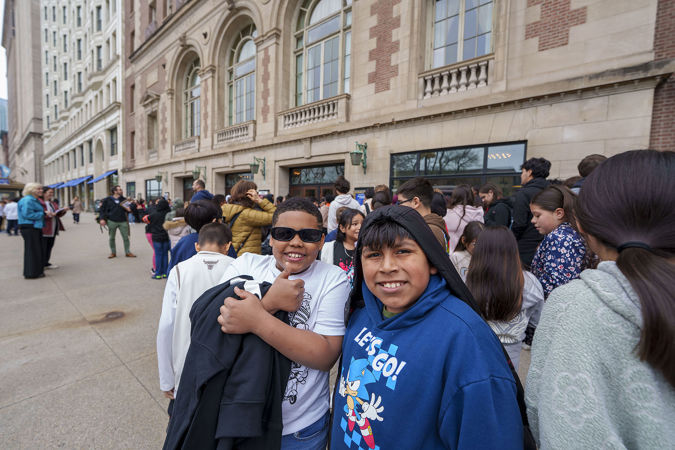 Two young audience members posing outside Symphony Center on Michigan Avenue