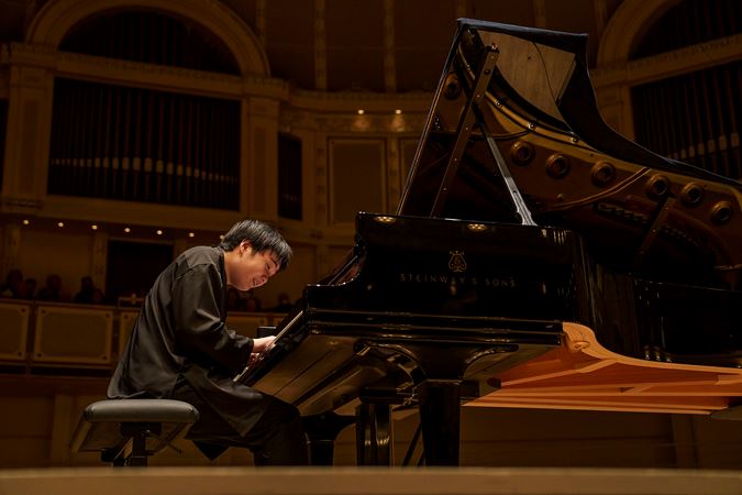Close up of Mao Fujita playing the piano from the Main Floor