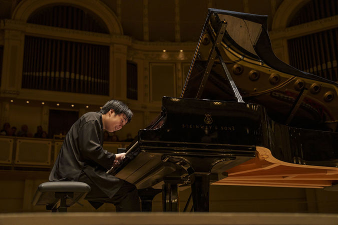 Close up of Mao Fujita playing the piano from the Main Floor