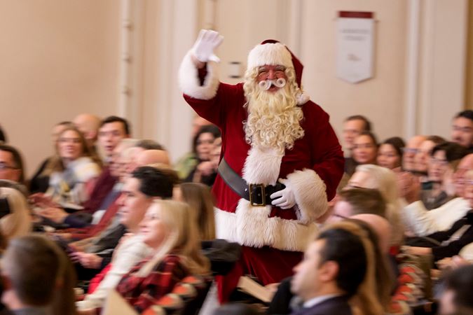 Santa Claus waving to the audience in Orchestra Hall