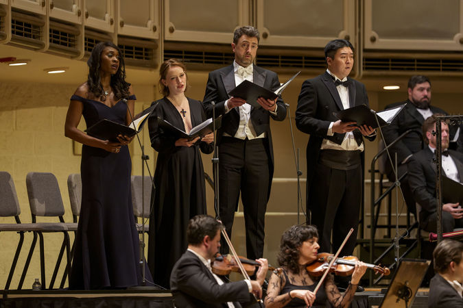 Group Shot Of Vocal Soloists Jeanine De Bique, Avery Amereau, Ben Bliss And Stephano Park Singing On Stage