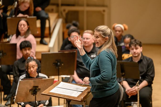 Conductor Erica Neidlinger in rehearsal.