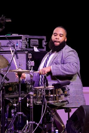 Closeup shot of drummer Nazir Ebo on stage