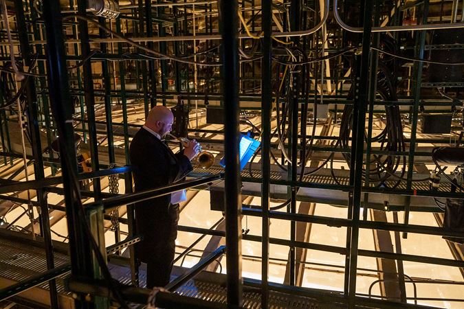 CSO Principal Trumpet Esteban Batallán behind the scenes above the stage
