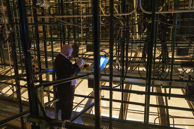 CSO Principal Trumpet Esteban Batallán behind the scenes above the stage
