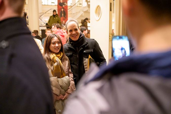 CSO horn Oto Carrillo poses with a fan for a photo after the concert