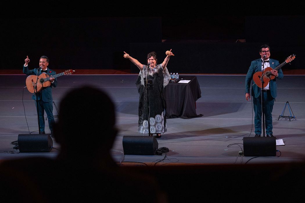 the members of Los Angeles-based trio Tres Souls point to and engage the audience during their set