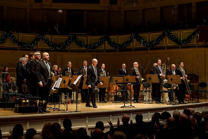 the full brass and percussion ensemble takes a bow