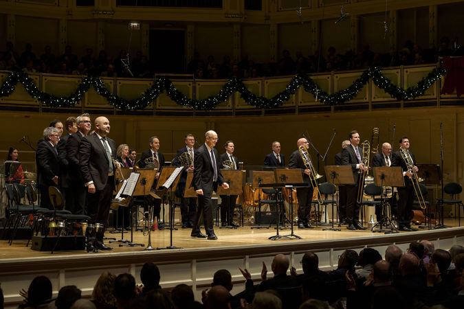 the full brass and percussion ensemble takes a bow