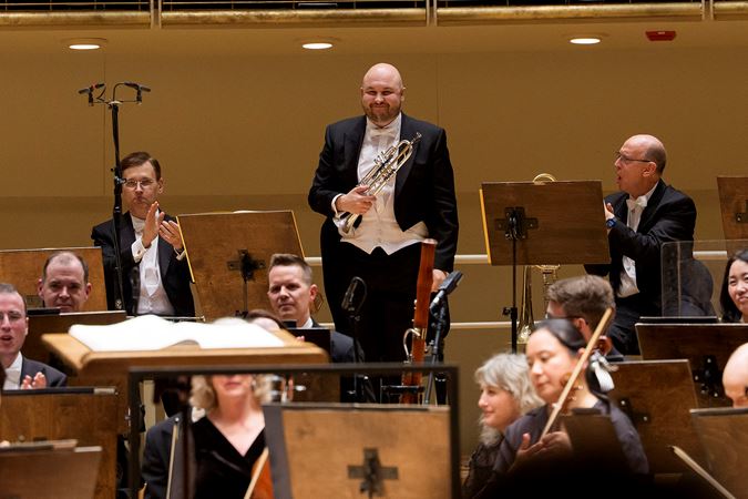 CSO Principal Trumpet Esteban Batallán takes a bow at the end of the performance of Sibelius 2