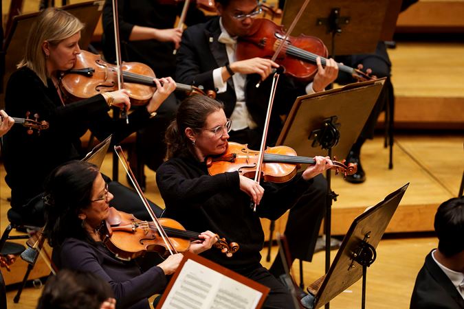 members of the CSO violin section performing