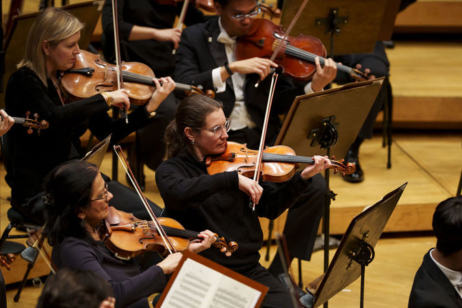 members of the CSO violin section performing