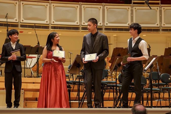 2025 Young Artists Competition finalists standing together with their awards on stage