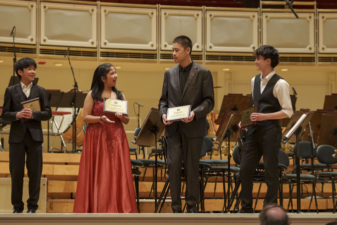 2025 Young Artists Competition finalists standing together with their awards on stage
