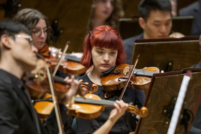 Group Shot Of Civic Violinists On Stage