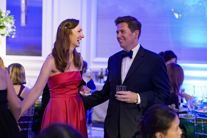 Closeup shot of CSO principal trombone Tim Higgins and wife standing and smiling at each other