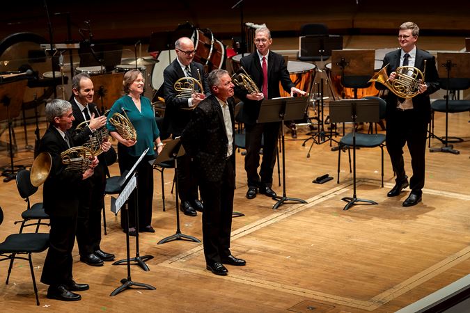 composer Steven Juliani is recognized on stage