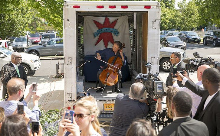 Ma gives a pop-up performance in the Auburn Gresham neighborhood in the Peace Bus, an anti-gun violence awareness vehicle operated by Strides for Peace.