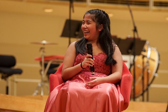 2025 Young Artists Competition finalist Evangeline Wang laughing during a postconcert Q&A session