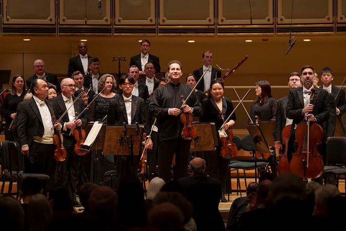 A bow shot of Nikolaj Szeps-Znaider and the Chicago Symphony Orchestra