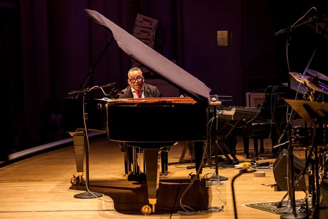 through the window between the piano keyboard and lid, Gonzalo Rubalcaba concentrates on the music