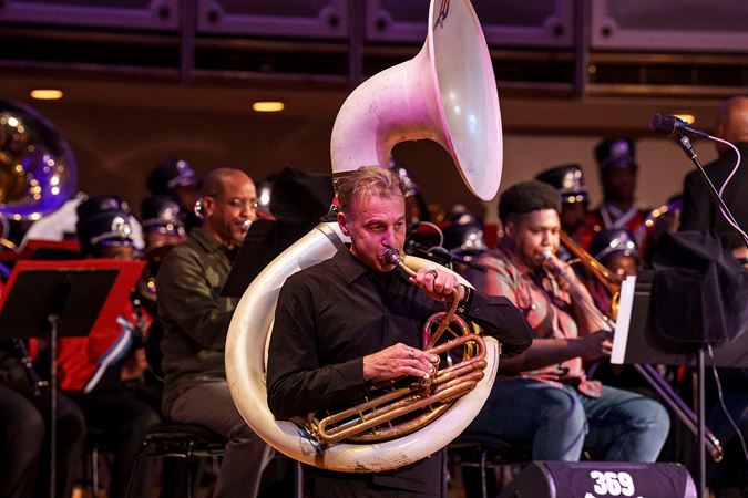 Closeup of Jose Davila playing the tuba