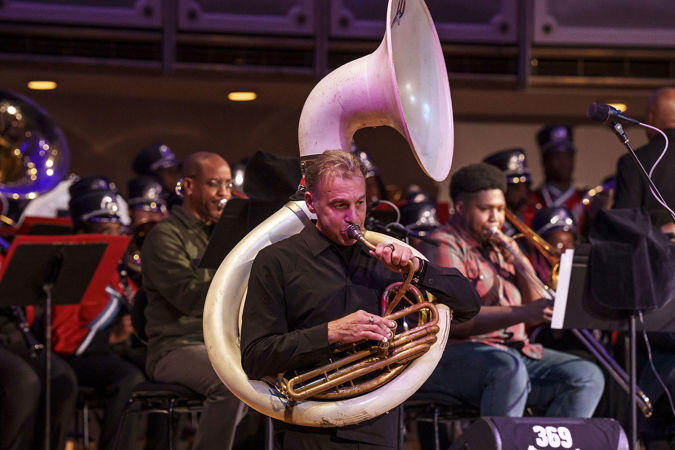 Closeup of Jose Davila playing the tuba