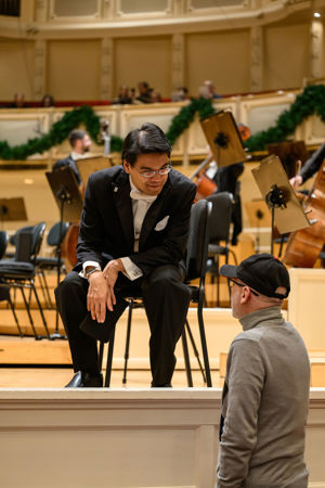 CSO viola Youming Chen greets an audience member before the concert