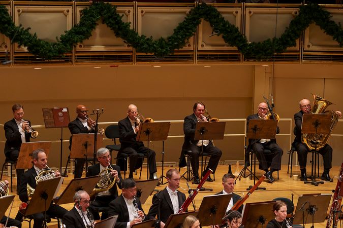 members of the CSO brass and woodwind sections performing