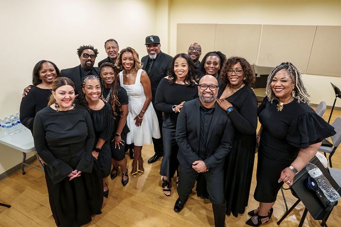 A backstage group shot of singer Heather Headley and the Fred Nelson III Ensemble