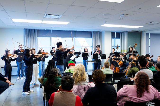 A Civic strings and oboe ensemble perform for communities members at UCAN during the 2025 Bach Marathon