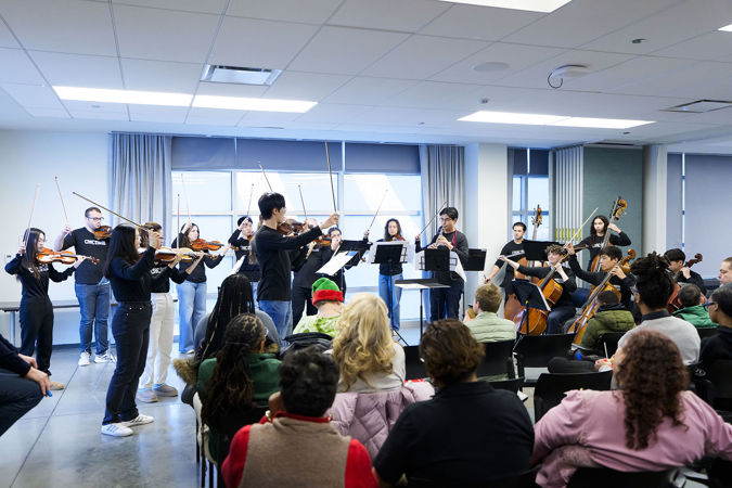 A Civic strings and oboe ensemble perform for communities members at UCAN during the 2025 Bach Marathon