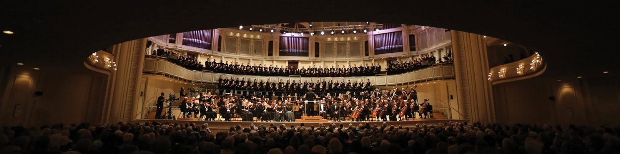 Dark hall stage CSO musicians chorus