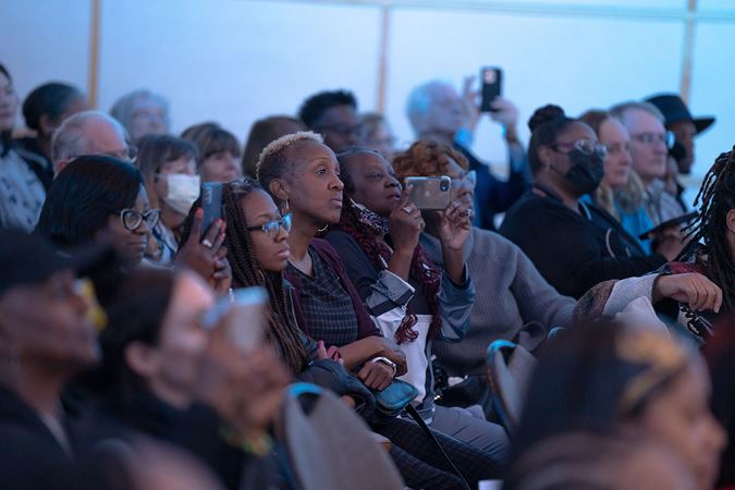 audience members taking photos