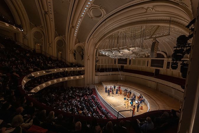 a view of the Sphinx Virtuosi on stage looking down from the right balcony