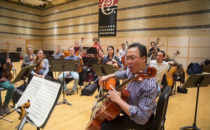 An animated Yo-Yo Ma leads a Civic rehearsal in Buntrock Hall.