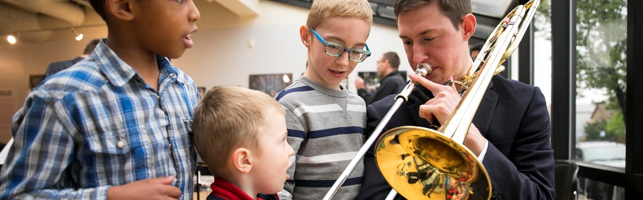 Civic Fellow trombone with kids