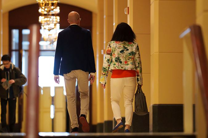Two patrons walking through Symphony Center's Arcade to attend the Víkingur Ólafsson piano recital
