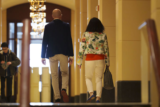 Two patrons walking through Symphony Center's Arcade to attend the Víkingur Ólafsson piano recital