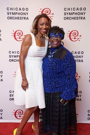 Singer Heather Headley takes photos with a fan postconcert