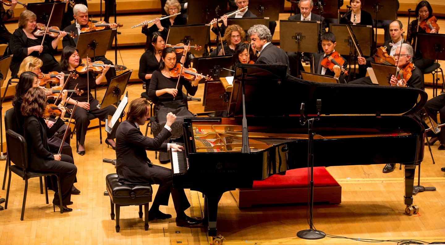 Trifonov finishes his performance of a piano concerto in a performance with the the CSO.